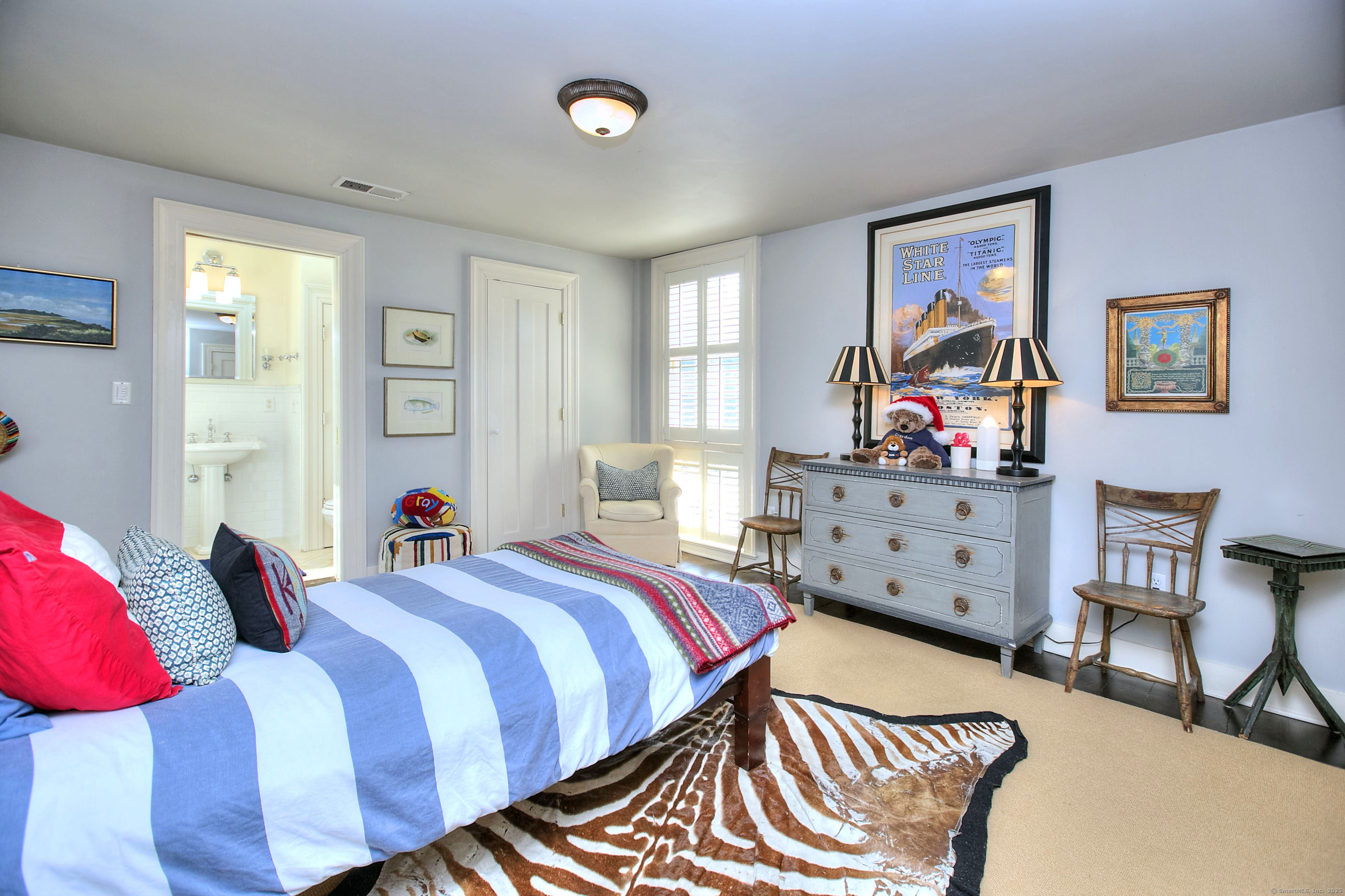 2683 Bronson Road Fairfield, CT 06824 - Photo 27 of 39 a bedroom with a bed and a window