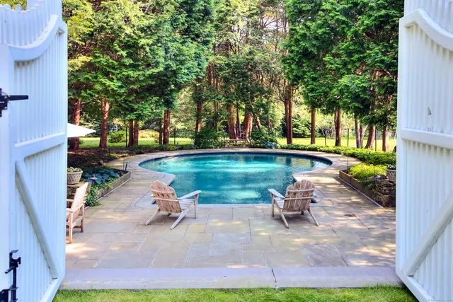 a view of a swimming pool with a patio