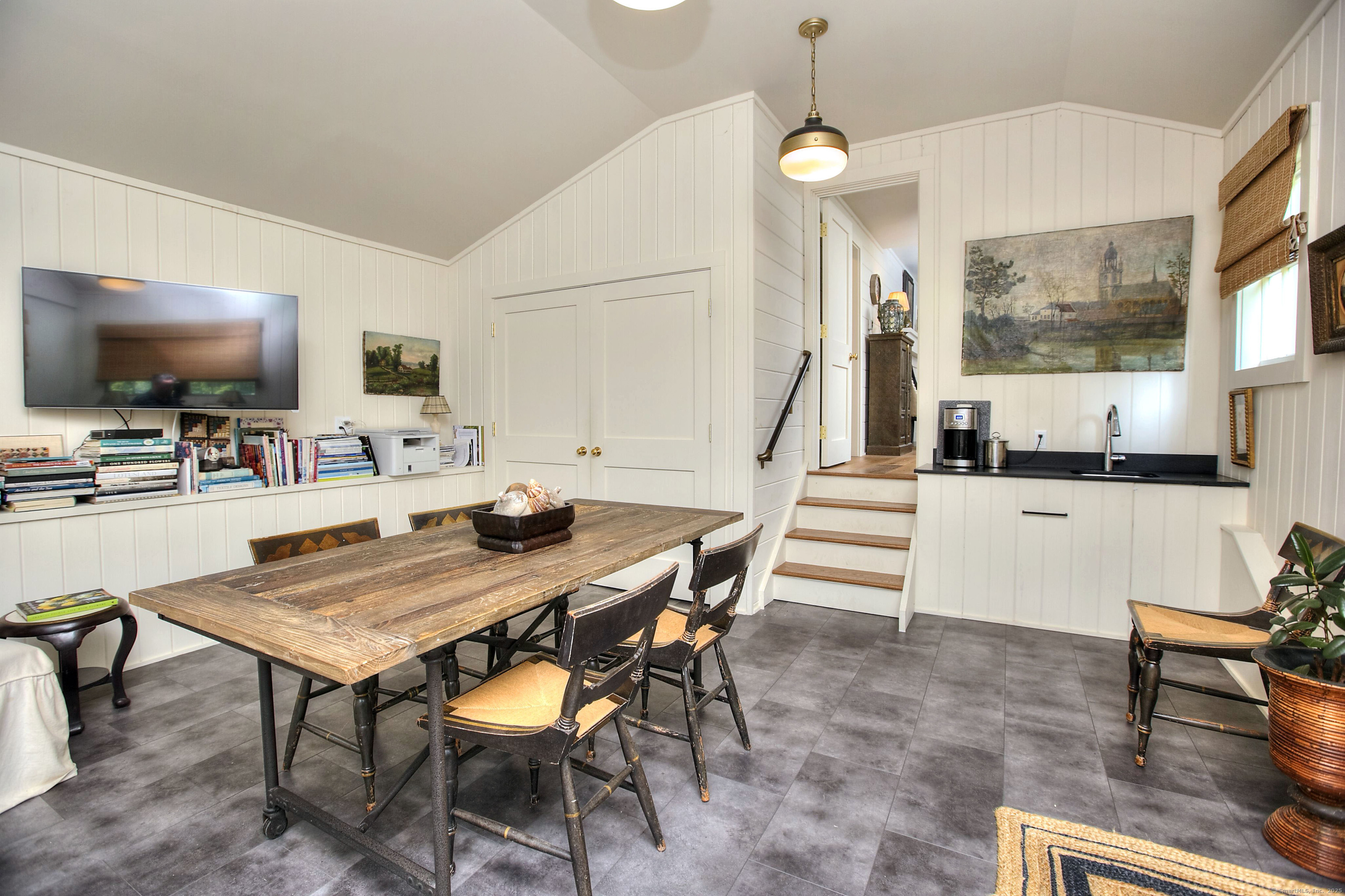 2683 Bronson Road Fairfield, CT 06824 - Photo 35 of 39 a dining room with furniture and wooden floor