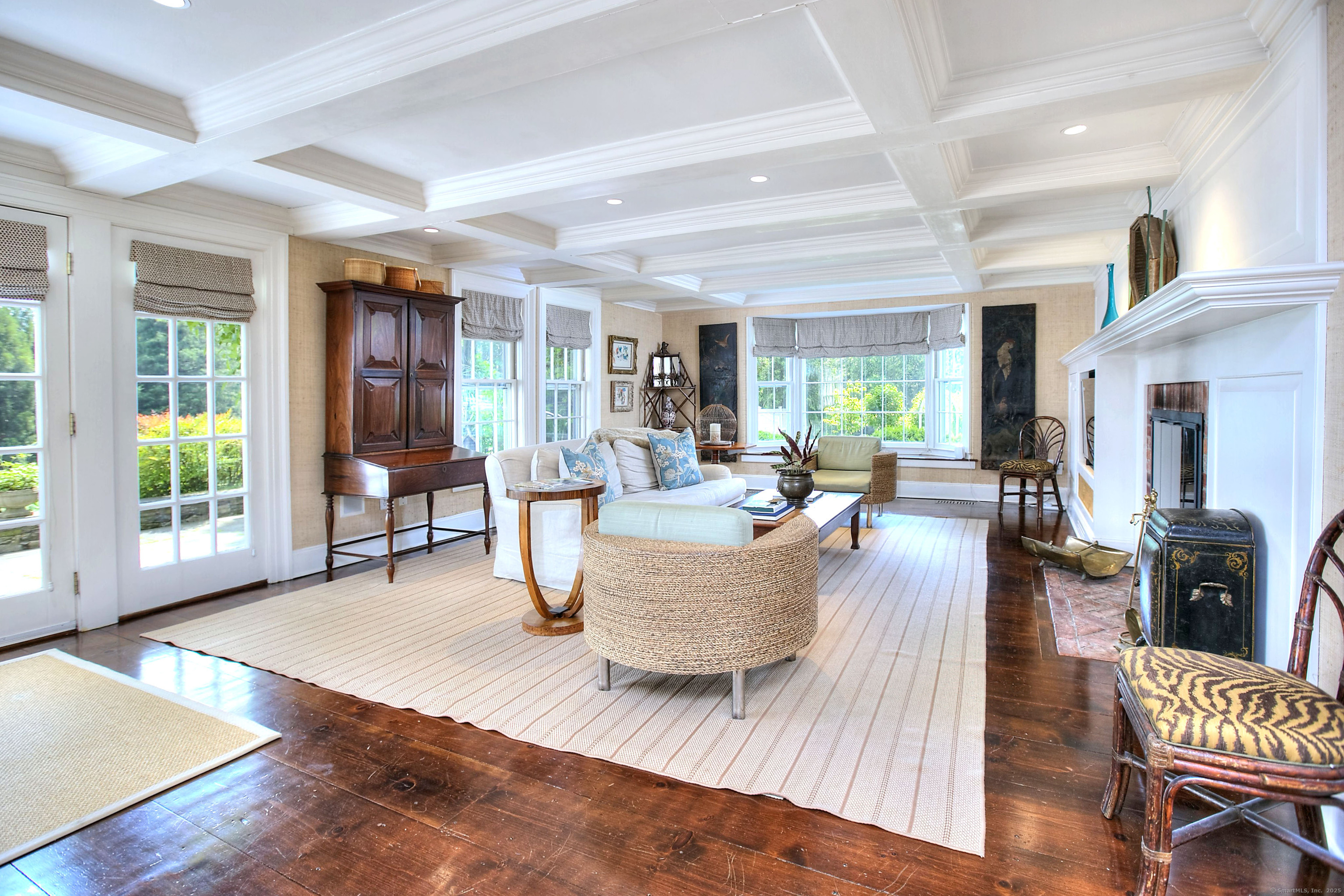 2683 Bronson Road Fairfield, CT 06824 - Photo 6 of 39 a living room with furniture and a large window