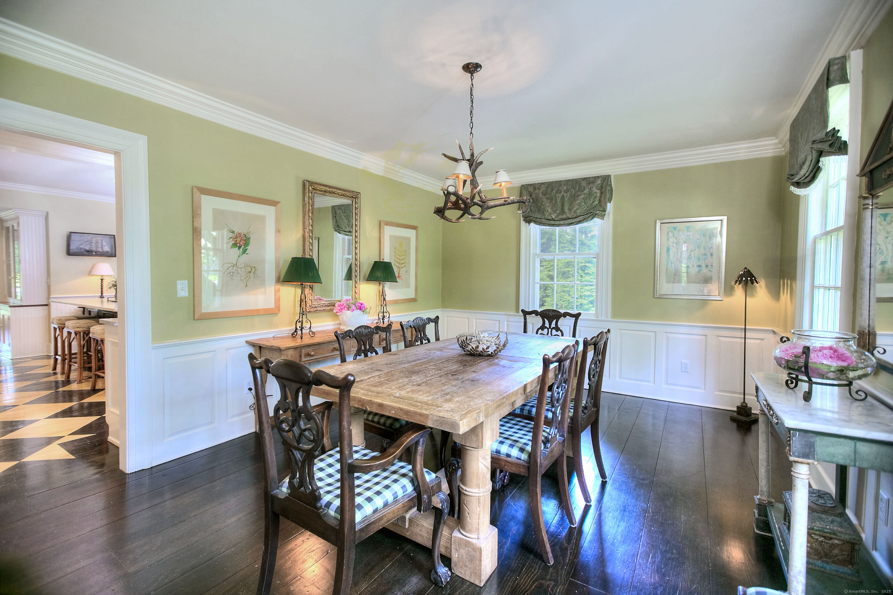 2683 Bronson Road Fairfield, CT 06824 - Photo 10 of 39 a view of a dining room with furniture window and wooden floor