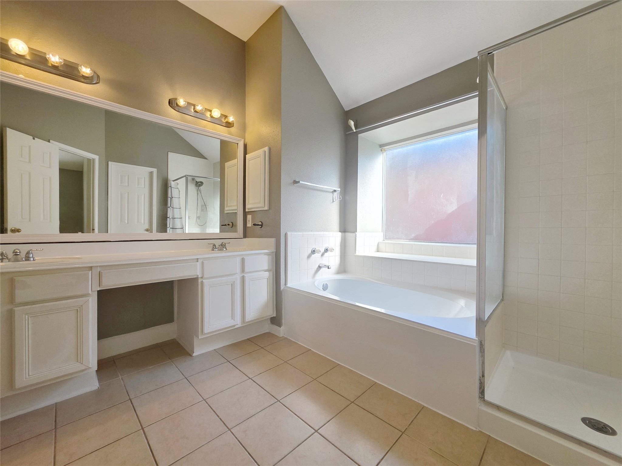 23527 Cansfield Way Katy, TX 77494 - Photo 17 of 30 a spacious bathroom with a tub sink and mirror