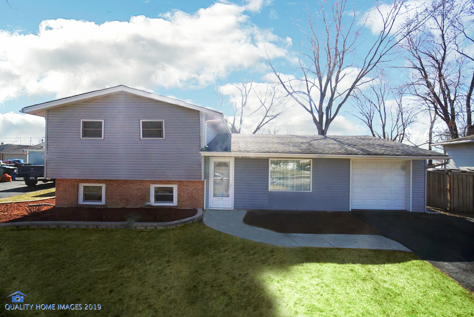551 Spruce Road Bolingbrook, IL 60440 - Photo 1 of 22 a front view of a house with a yard