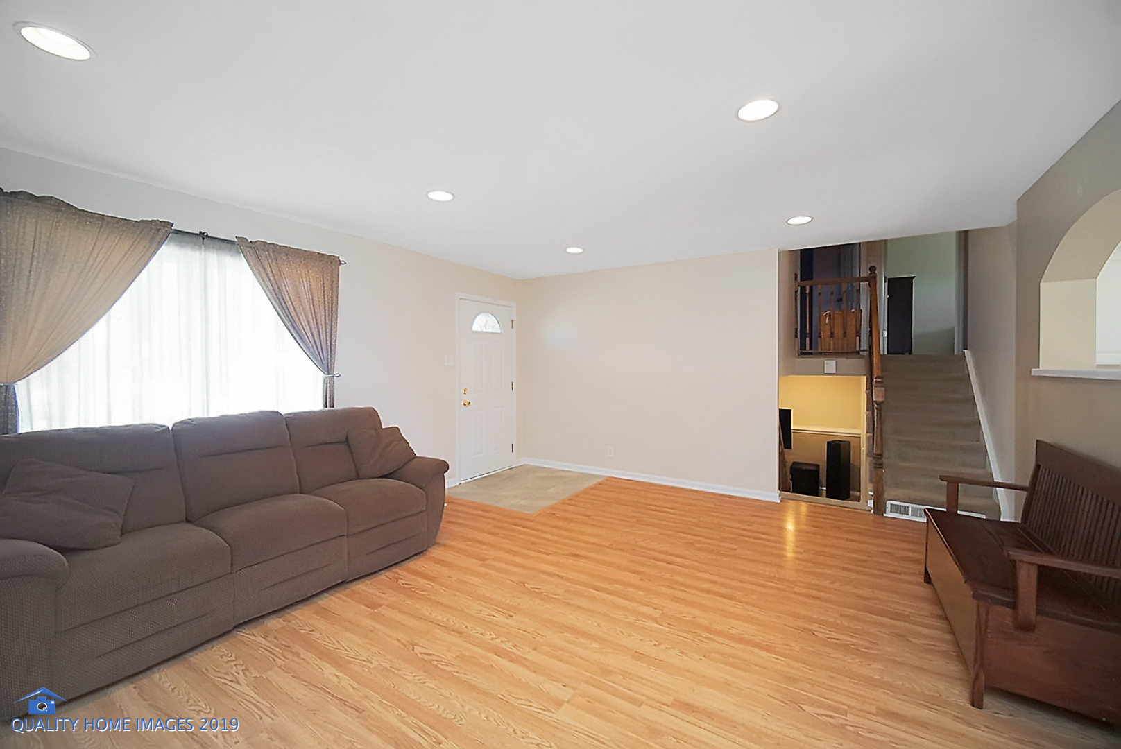 551 Spruce Road Bolingbrook, IL 60440 - Photo 2 of 22 a living room with furniture and a flat screen tv