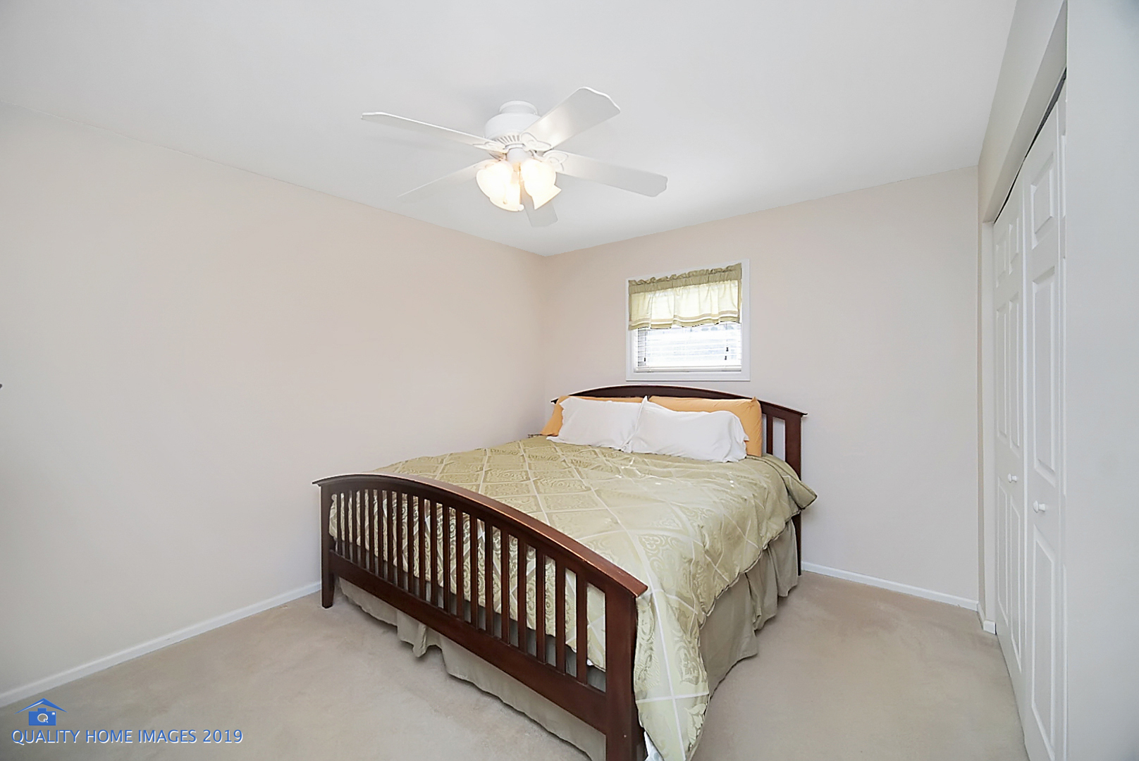 551 Spruce Road Bolingbrook, IL 60440 - Photo 13 of 22 a bedroom with a bed and a chandelier