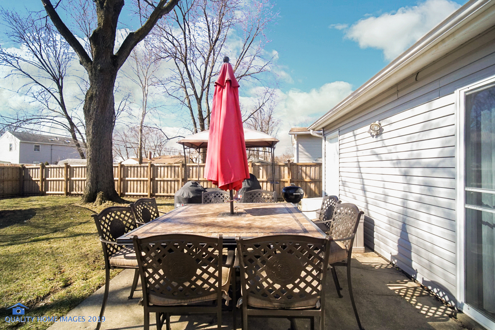 551 Spruce Road Bolingbrook, IL 60440 - Photo 19 of 22 a view of a patio with a table and chairs