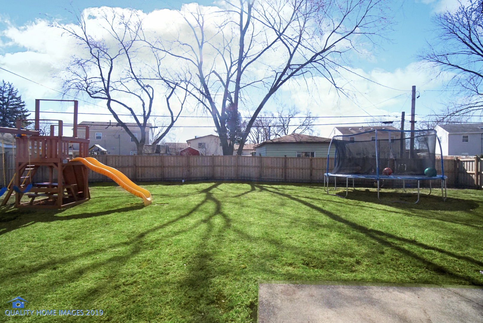 551 Spruce Road Bolingbrook, IL 60440 - Photo 20 of 22 a view of a backyard with plants and a slide