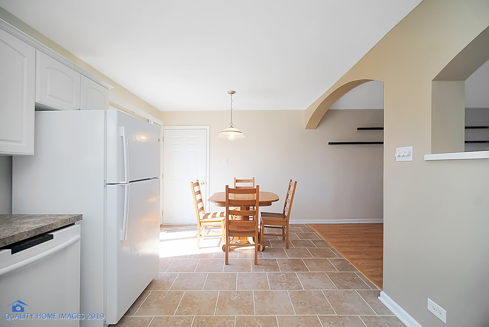 551 Spruce Road Bolingbrook, IL 60440 - Photo 4 of 22 a view of a kitchen with furniture and wooden floor
