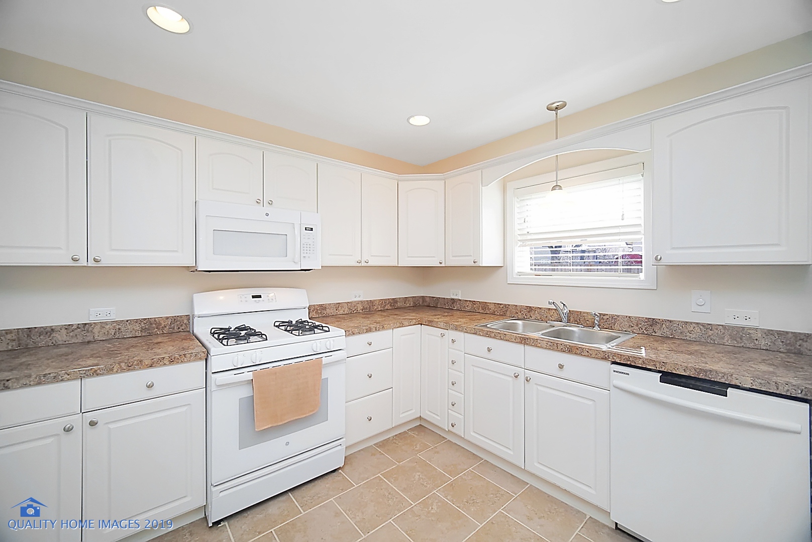 551 Spruce Road Bolingbrook, IL 60440 - Photo 7 of 22 a kitchen with granite countertop white cabinets and white appliances