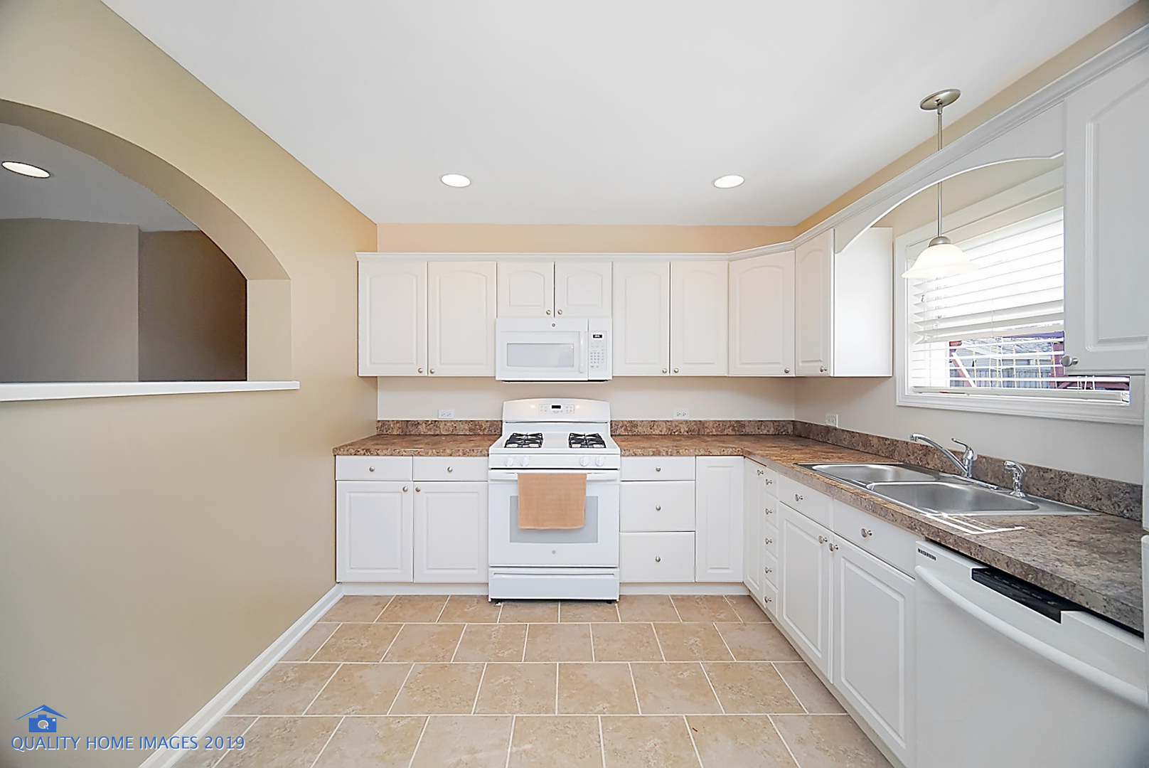 551 Spruce Road Bolingbrook, IL 60440 - Photo 8 of 22 a large kitchen with a stove top oven sink and cabinets