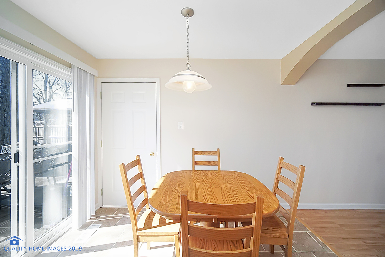 551 Spruce Road Bolingbrook, IL 60440 - Photo 9 of 22 a blue chair sitting next to a window
