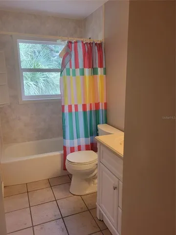 a bathroom with a sink toilet and bathtub