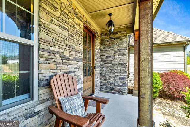 a view of a dining room with furniture wooden floor and a chandelier