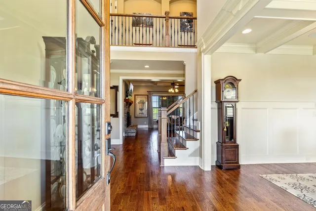 a large kitchen with lots of furniture and stainless steel appliances