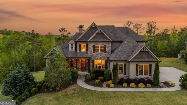 a view of house with swimming pool outdoor seating