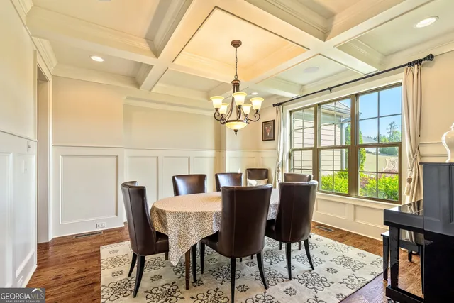 a living room with furniture a fireplace and a ceiling fan