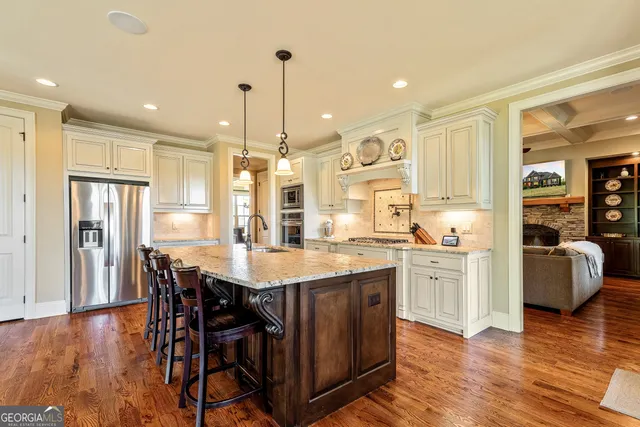 a bedroom with a bed lamps and table