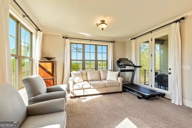 a bed room with a bed and a ceiling fan