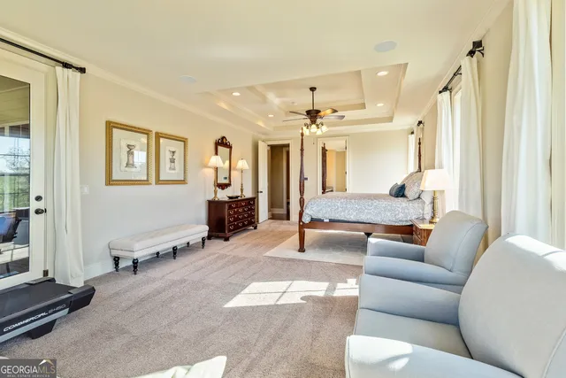 a bedroom with a large bed and a dresser