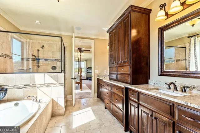 a bathroom with a granite countertop sink toilet a mirror and shower