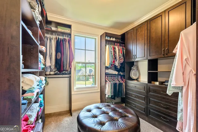a view of a patio with table and chairs and potted plants
