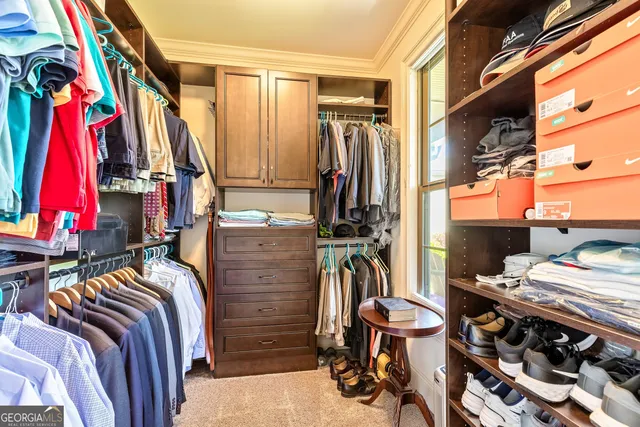 a view of a patio with table and chairs and potted plants