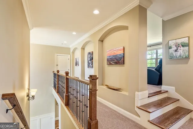an aerial view of a house with outdoor space and lake view