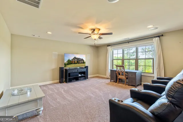 a view of a swimming pool with an outdoor seating and yard
