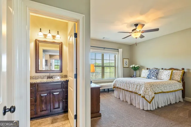 an aerial view of a house with swimming pool and basket ball court