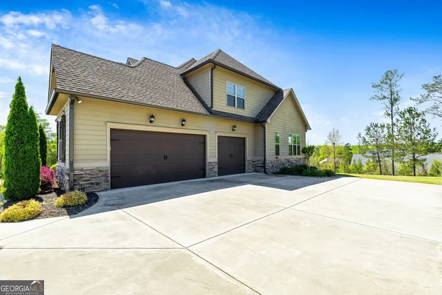 a front view of a house with garden