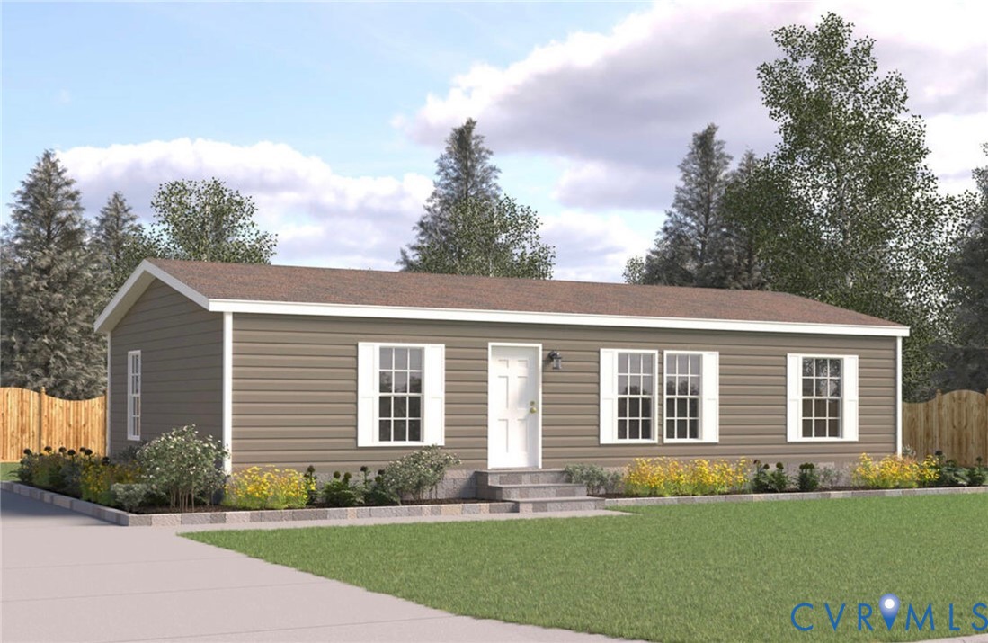 a front view of a house with a garden and yard