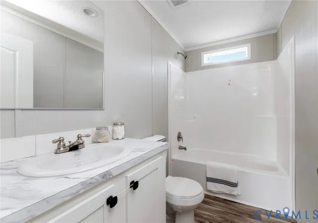 a bathroom with double sink and a mirror