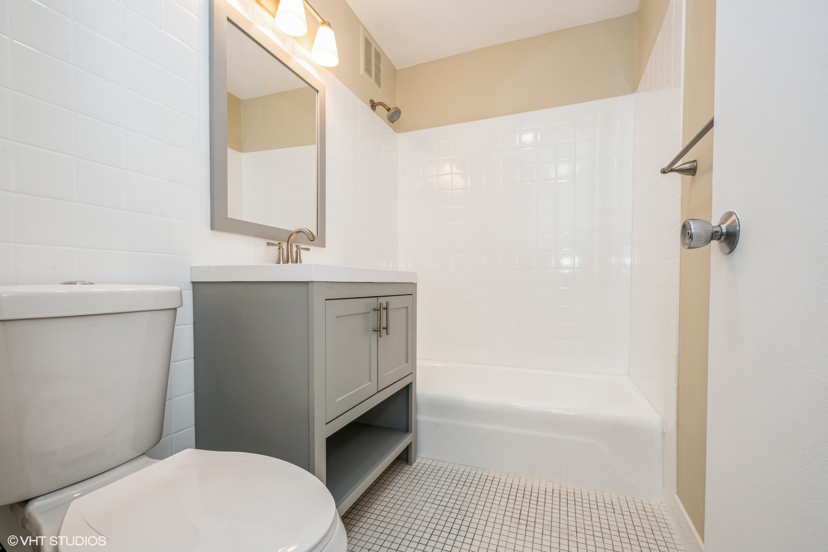 655 West Irving Park Road, Unit 1505 Chicago, IL 60613 - Photo 11 of 23 a bathroom with a sink a toilet and shower