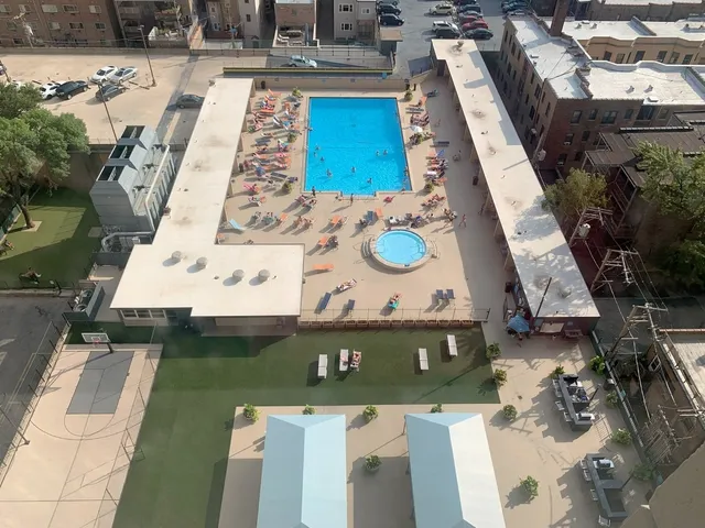 a view of a patio with a table and chairs and potted plants