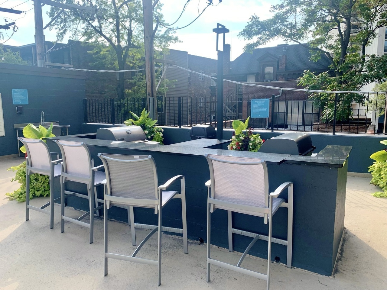 655 West Irving Park Road, Unit 1505 Chicago, IL 60613 - Photo 19 of 23 a table and chairs in patio of a house