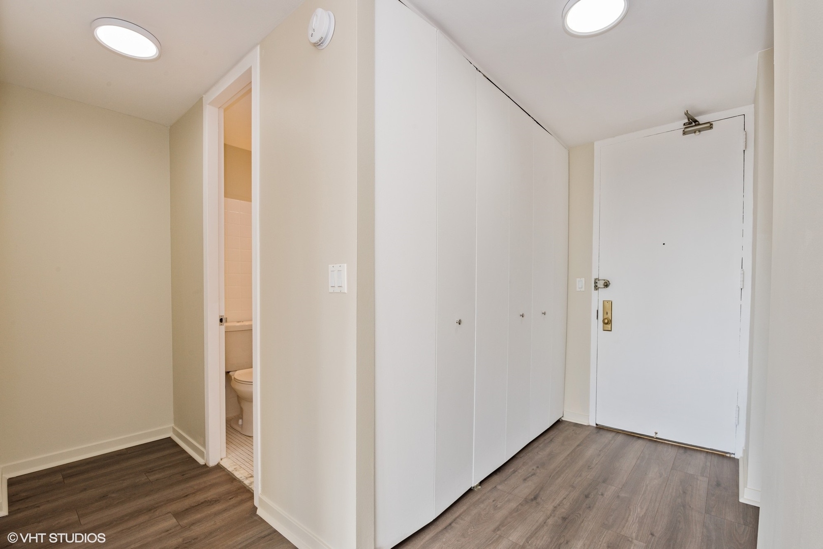 655 West Irving Park Road, Unit 1505 Chicago, IL 60613 - Photo 3 of 23 a view of hallway with wooden floor