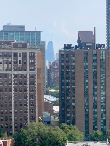 a view of an empty room and wooden floor