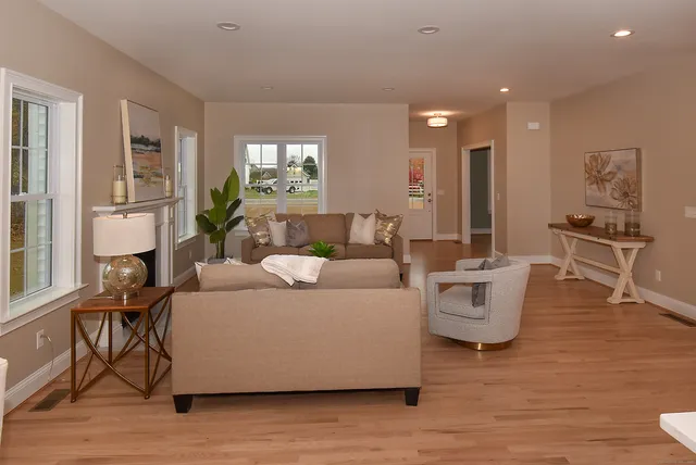 a living room with furniture and a table