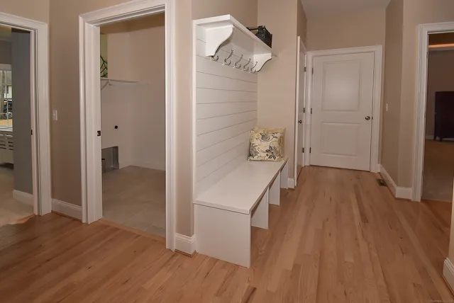 wooden floor in an empty room with a gallery