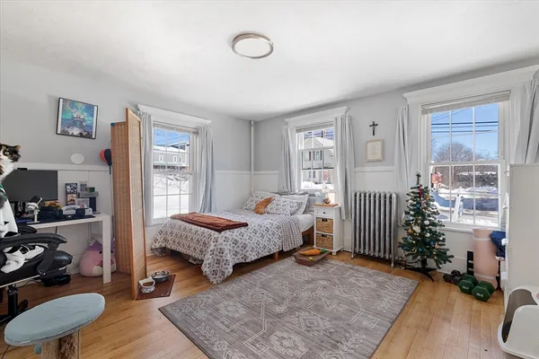 a bedroom with furniture and a bed
