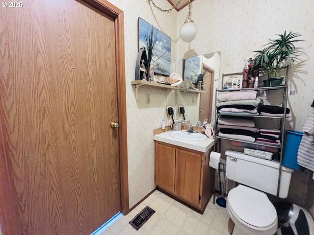129 Evergreen Lane Florence, OR 97439 - Photo 12 of 13 a view of bathroom with a toilet and a sink