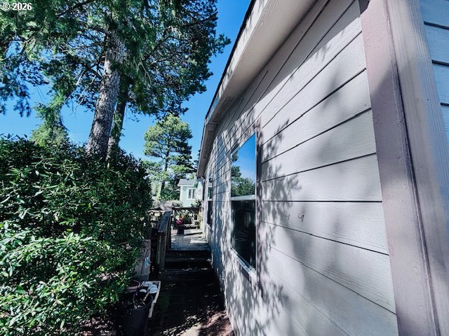 129 Evergreen Lane Florence, OR 97439 - Photo 5 of 13 a backyard of a house with lots of green space