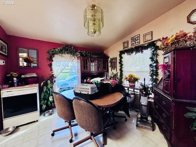 129 Evergreen Lane Florence, OR 97439 - Photo 10 of 13 a view of a dining room with furniture and chandelier