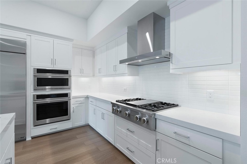 1306 Rivington Irvine, CA 92612 - Photo 11 of 75 a kitchen with cabinets and steel appliances