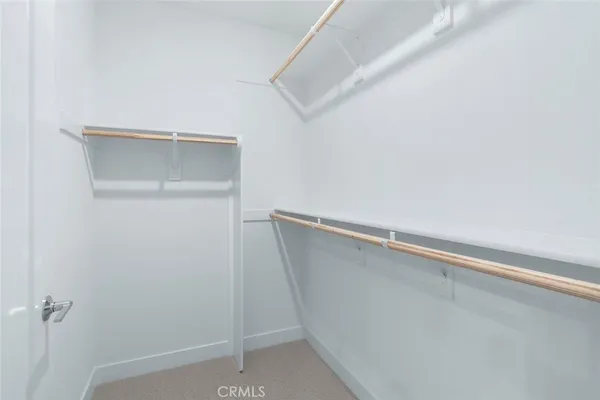a view of a hallway with washer and dryer