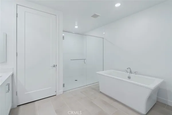 a view of a hallway with washer and dryer