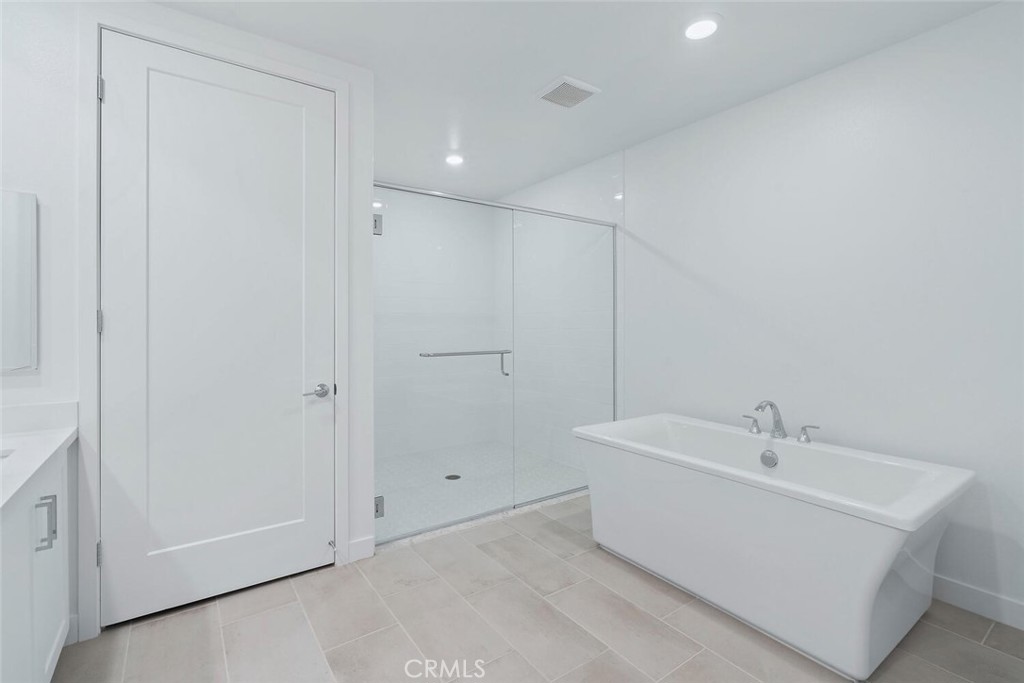 1306 Rivington Irvine, CA 92612 - Photo 18 of 75 a bathroom with a sink and a mirror