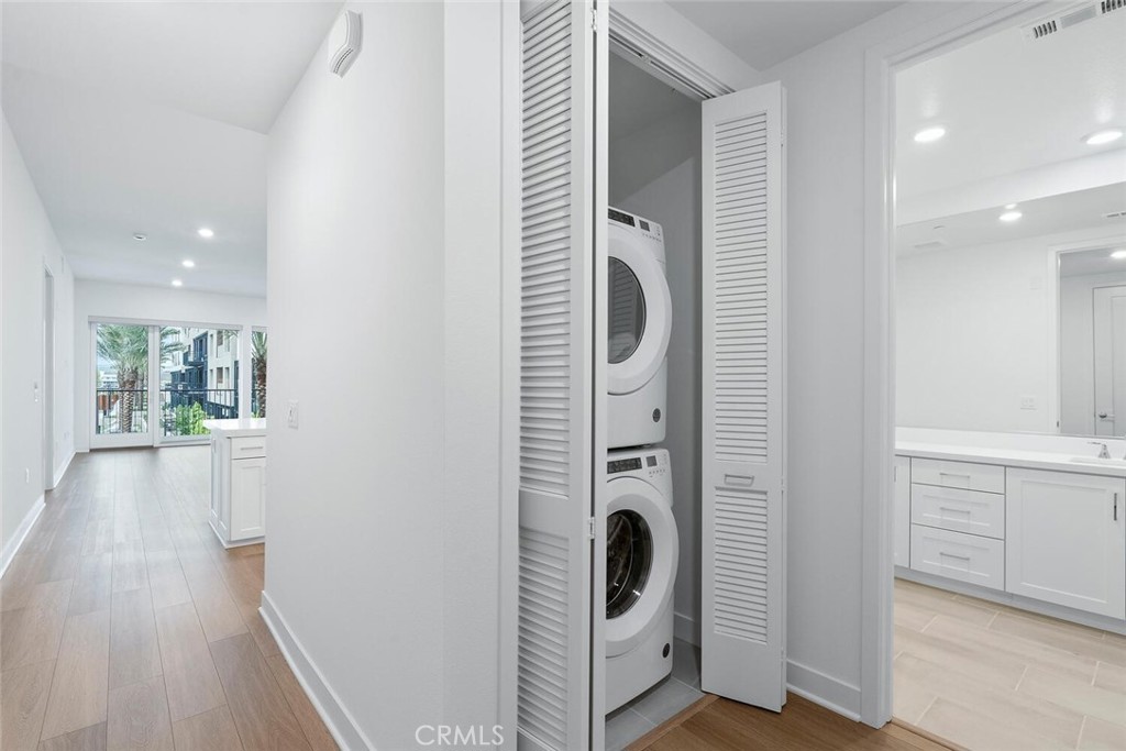 1306 Rivington Irvine, CA 92612 - Photo 22 of 75 a view of a hallway with washer and dryer