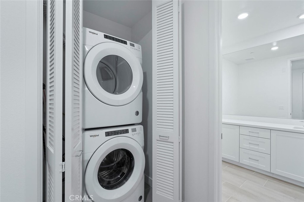 1306 Rivington Irvine, CA 92612 - Photo 23 of 75 a view of a hallway with washer and dryer