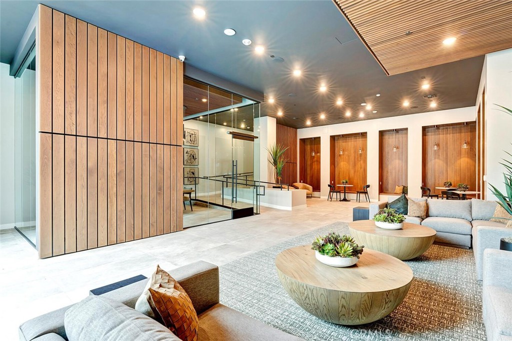 1306 Rivington Irvine, CA 92612 - Photo 32 of 75 a living room with furniture and a large window